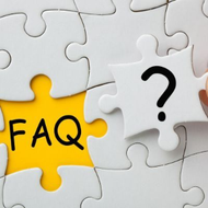 White puzzle pieces with a yellow “FAQ” piece and a black question mark