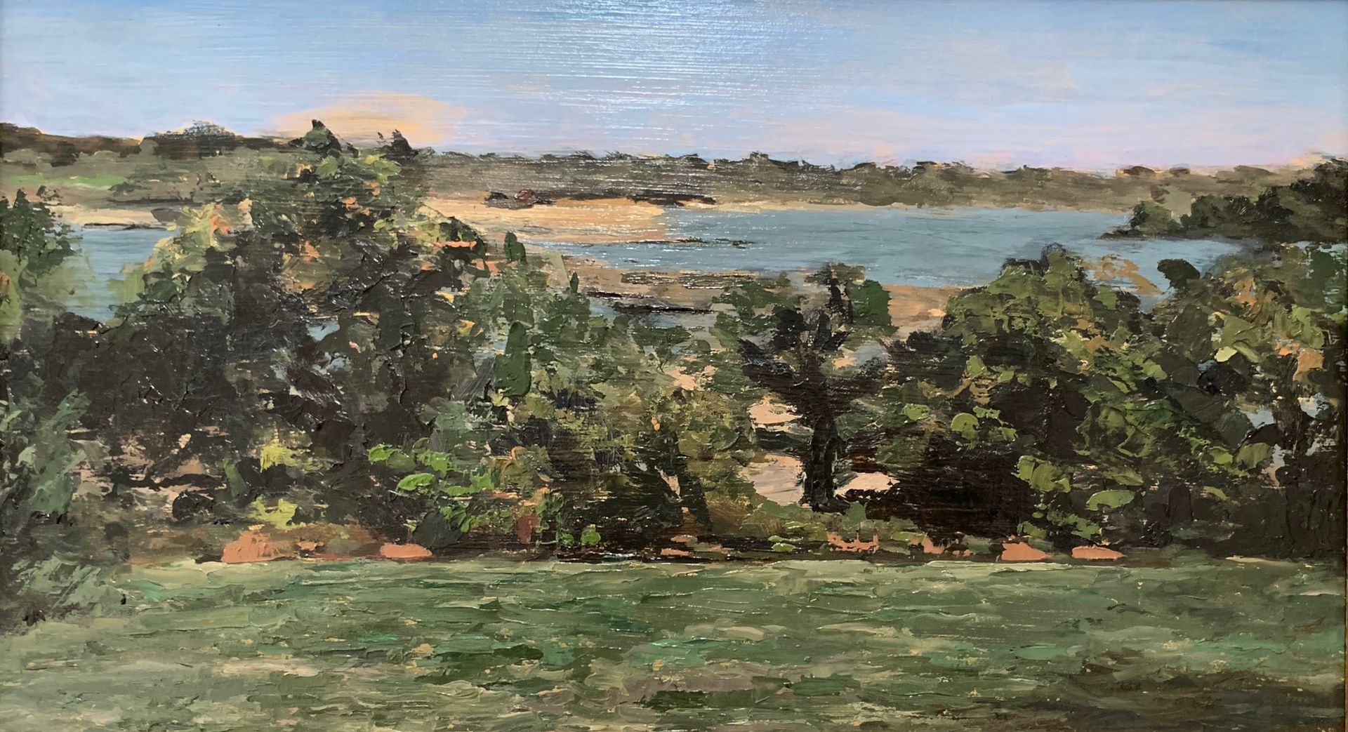 Impressionist landscape of green trees and grass beside a blue lake under a pale sky