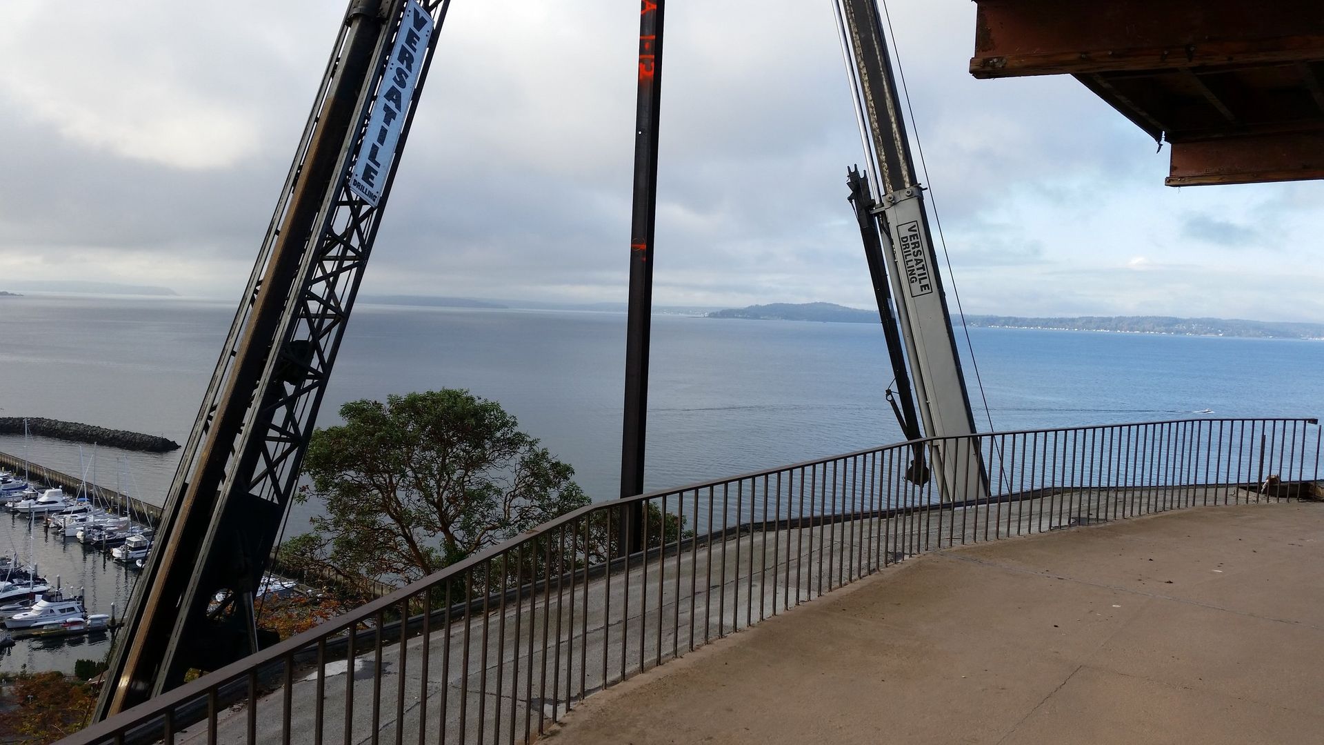 A view of the ocean from a balcony with a fence