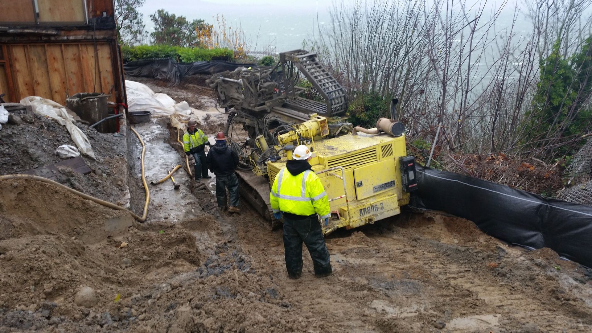 A group of construction workers are working on a construction site.