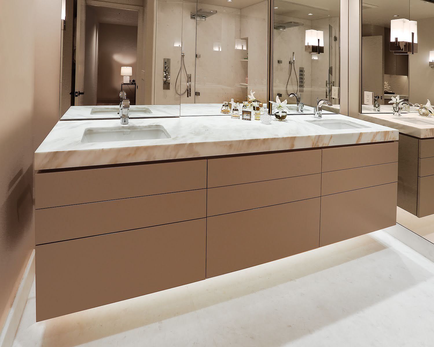 A bathroom with two sinks and two mirrors