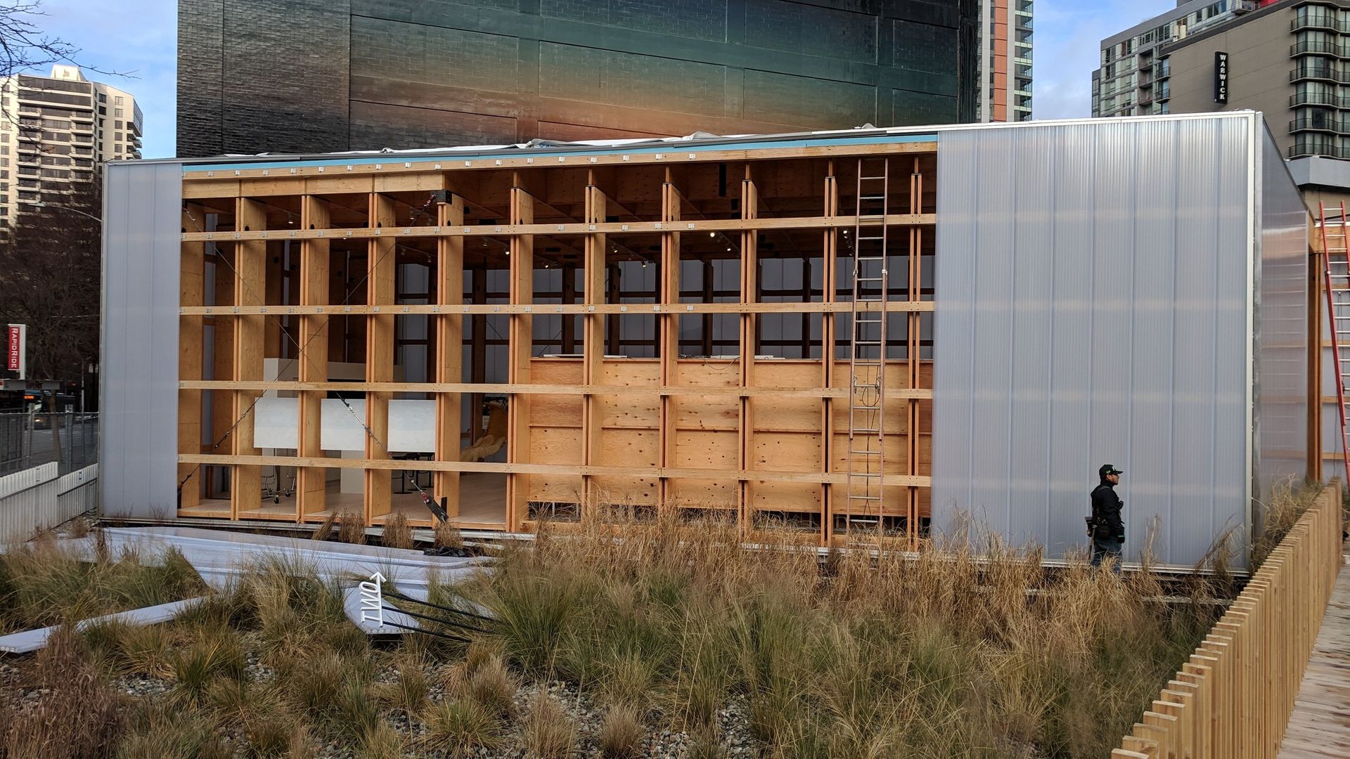 A large building with a lot of windows is being built