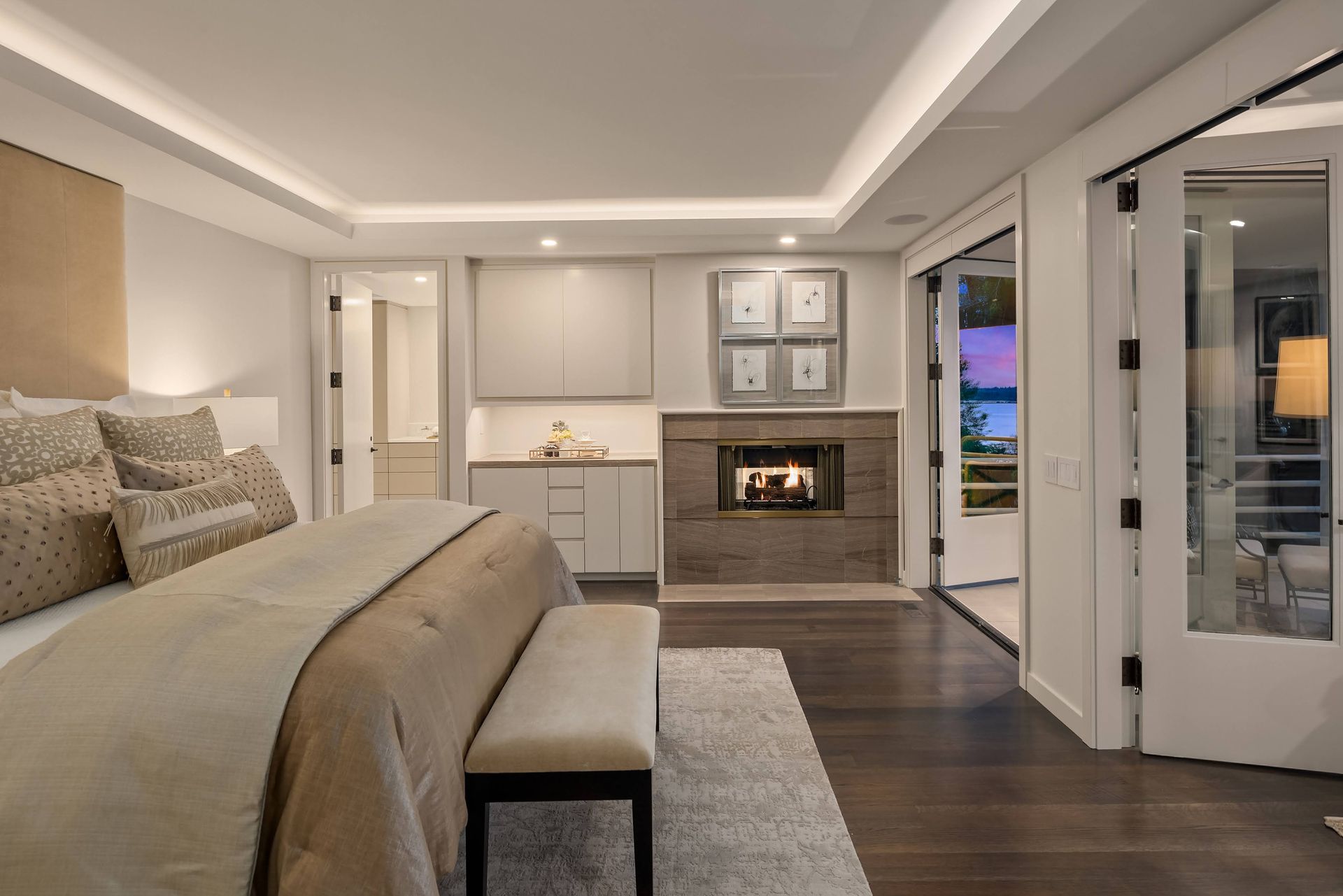 There is a fireplace in the middle of the bedroom.