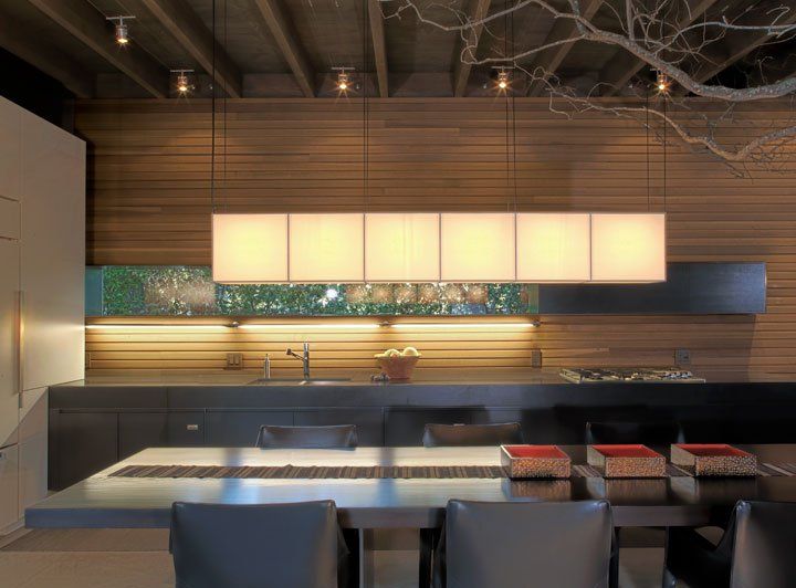 A kitchen with a table and chairs in it