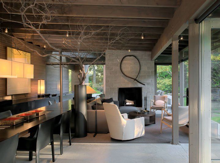 A living room with a fireplace and sliding glass doors