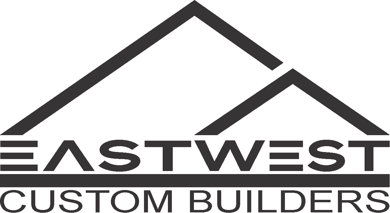 A black and white logo for eastwest custom builders.