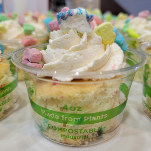 Small cups of plant-based ice cream topped with whipped cream and colorful cereal pieces