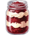 Jar of red berry dessert layered with cream and cake crumbs