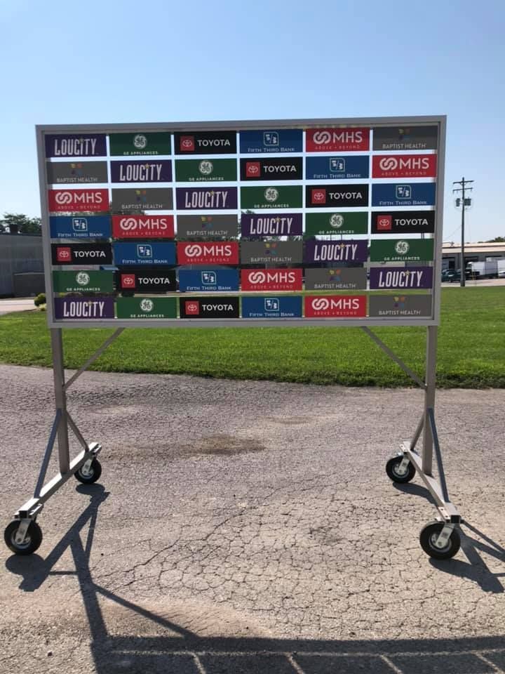 A large sign with a lot of license plates on it.