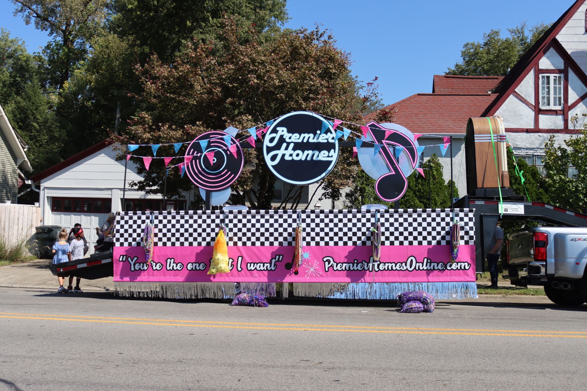 A float with a sign that says premier homes on it