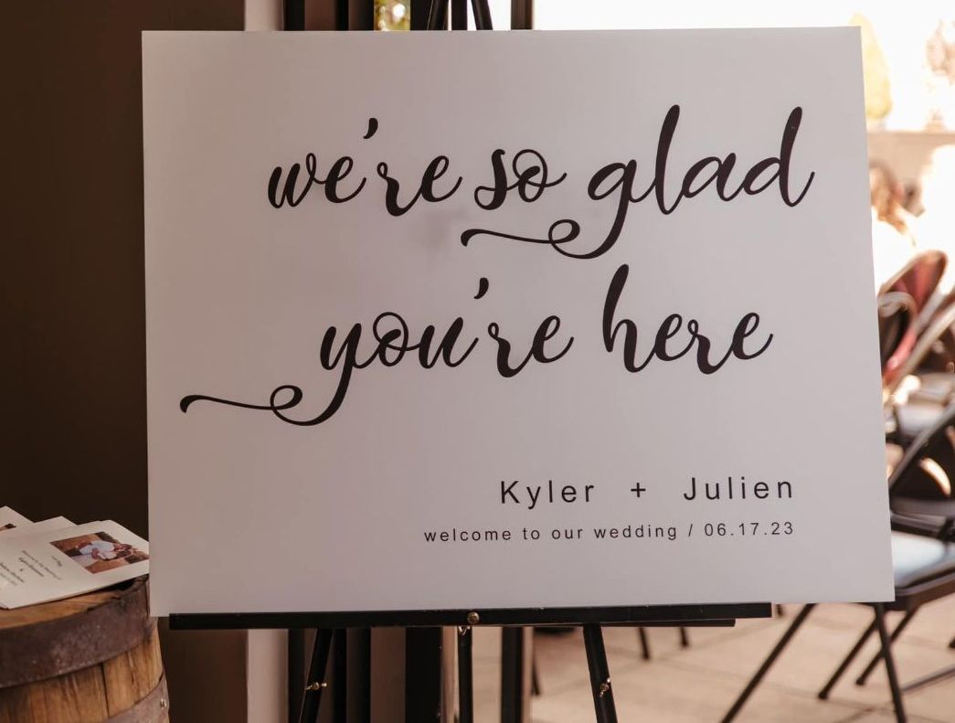 A sign that says we 're so glad you 're here