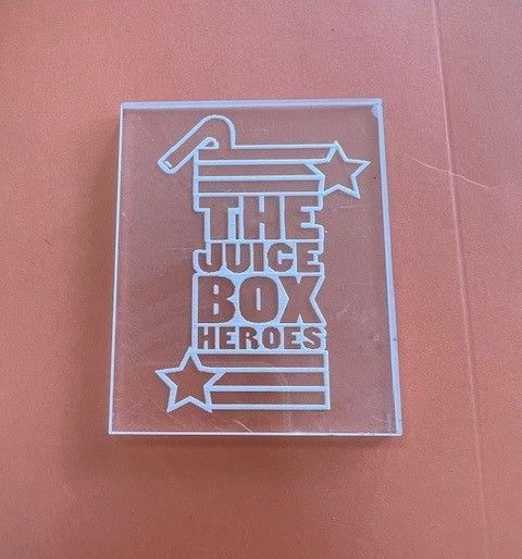 A clear box that says the juice box heroes
