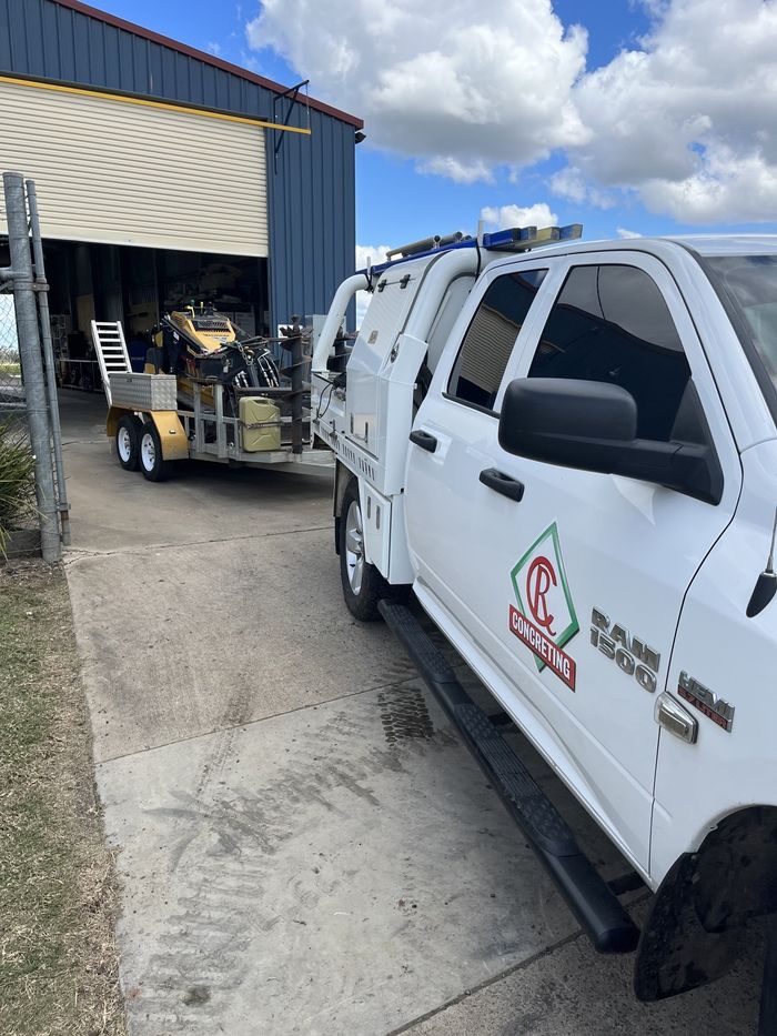 CR Concreting Car Towing Mini Skid Steer — C R Concreting in Pittsworth, QLD