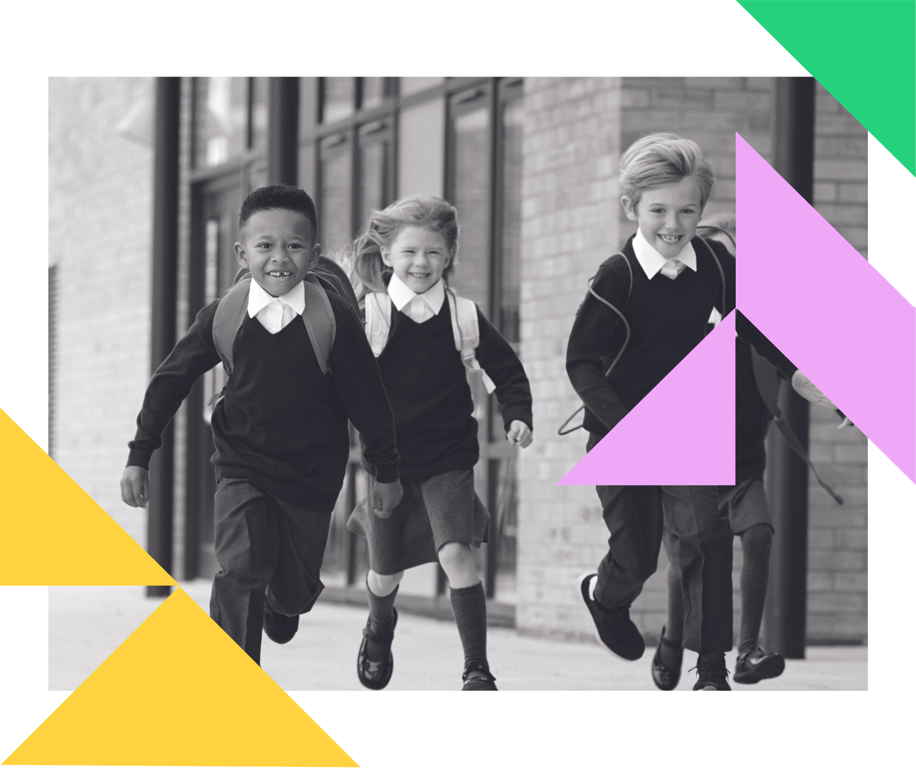 a group of children in school uniforms are running down a sidewalk .