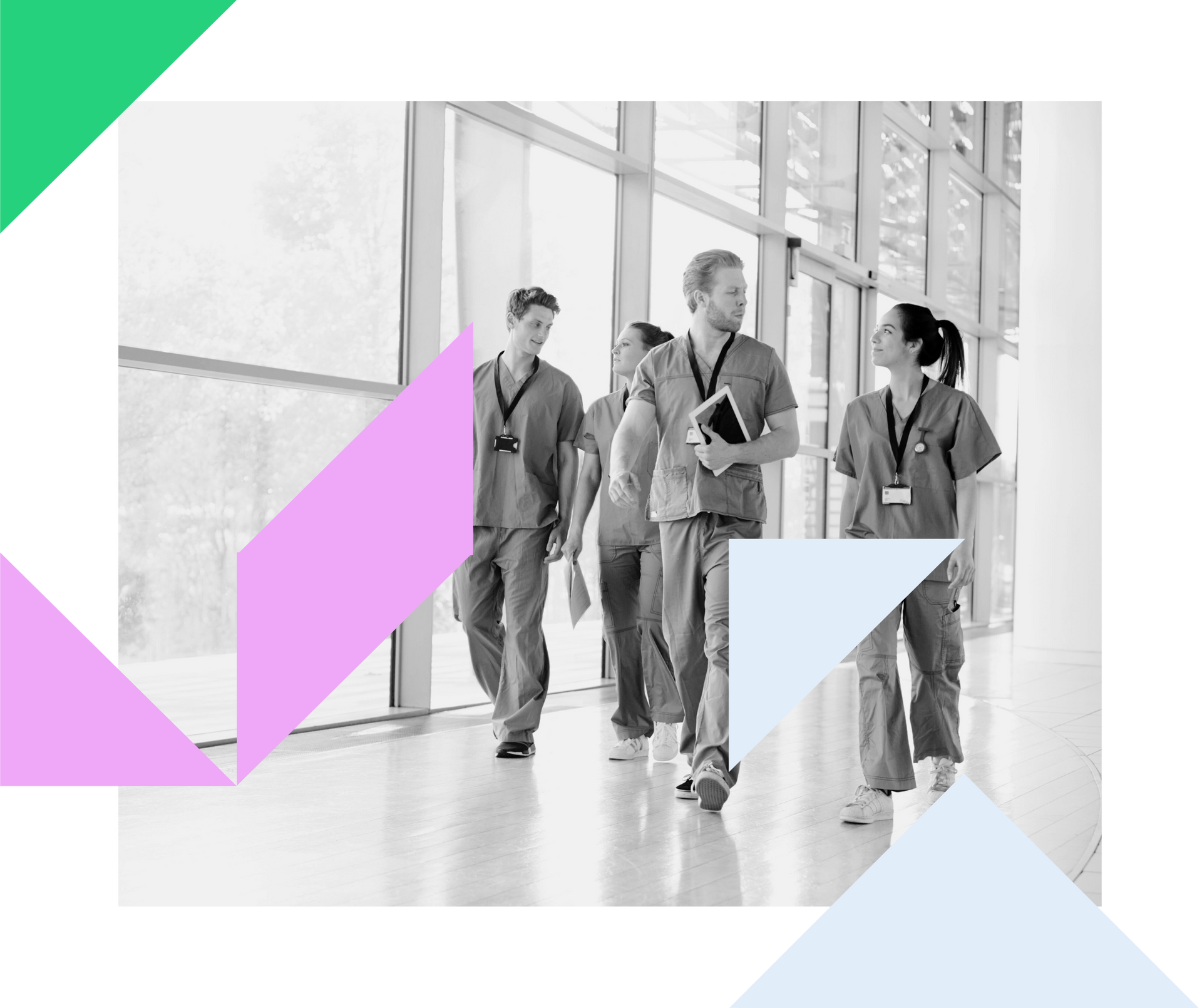 a group of doctors and nurses are walking down a hospital hallway .
