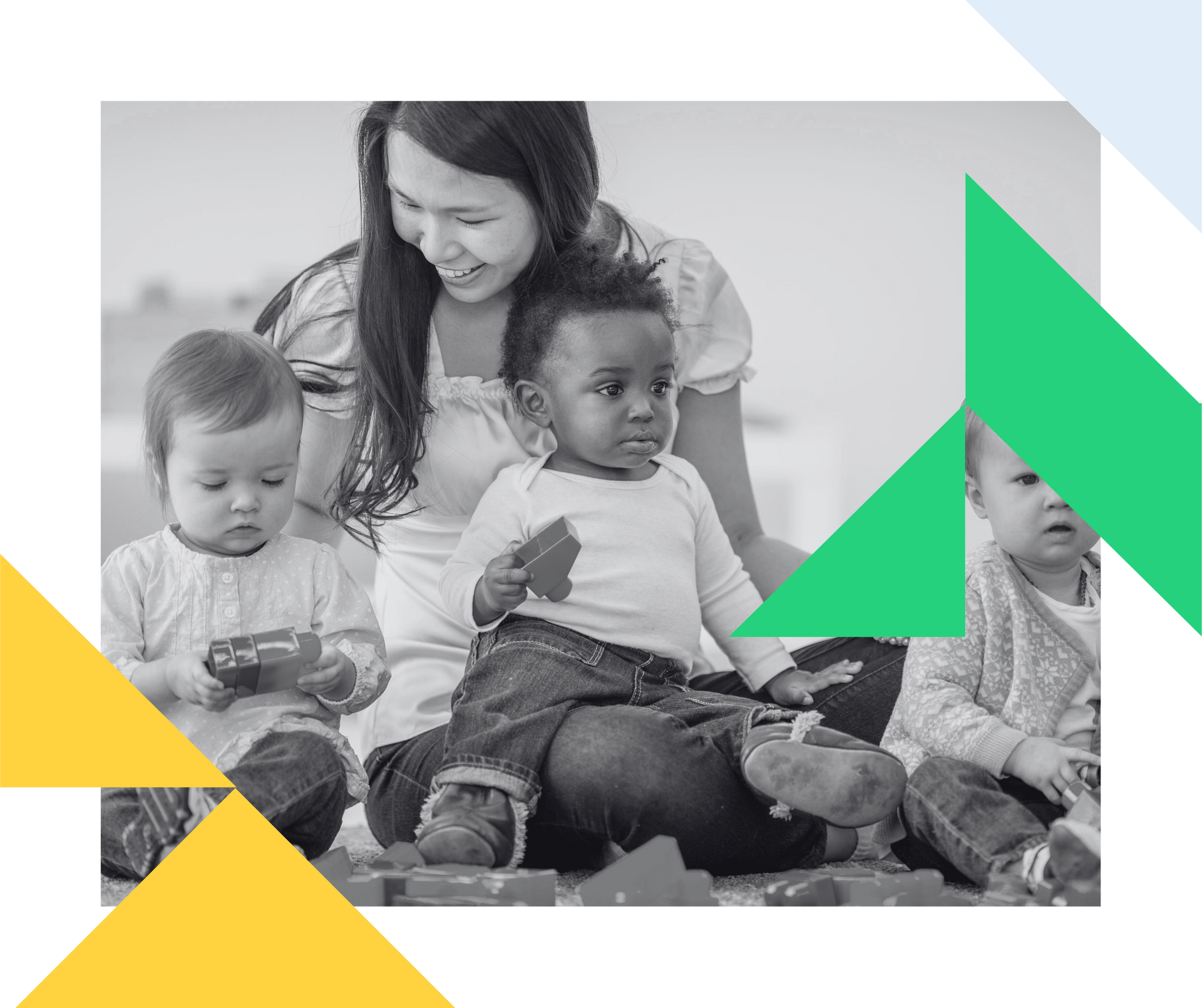 a woman is sitting on the ground with three babies .