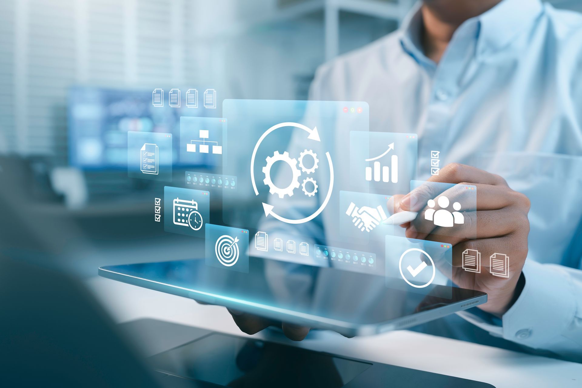 Businessperson using a tablet with floating medical data icons in a blue hospital setting