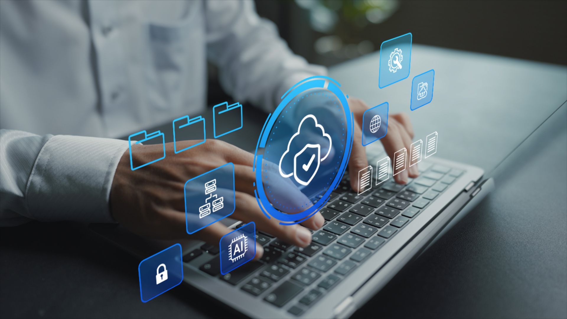 Hands typing on a laptop with glowing blue cloud security icons overlaid