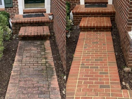 Two brick pathways to a house entrance; left walkway is worn, right walkway is newly paved.