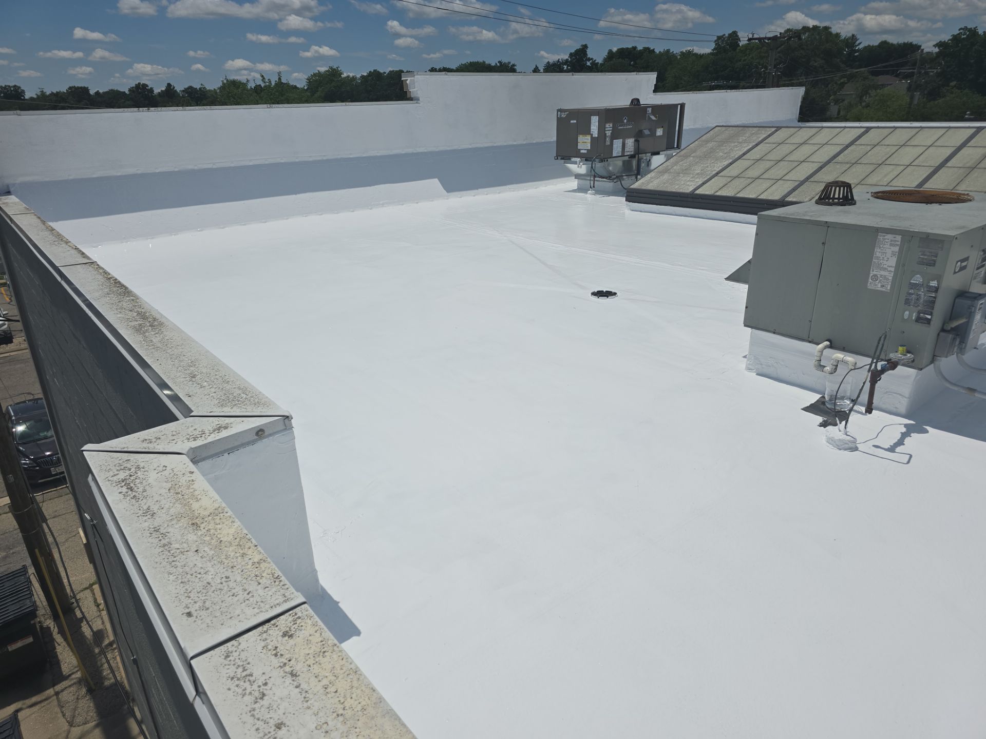 A white roof with a blue sky in the background.