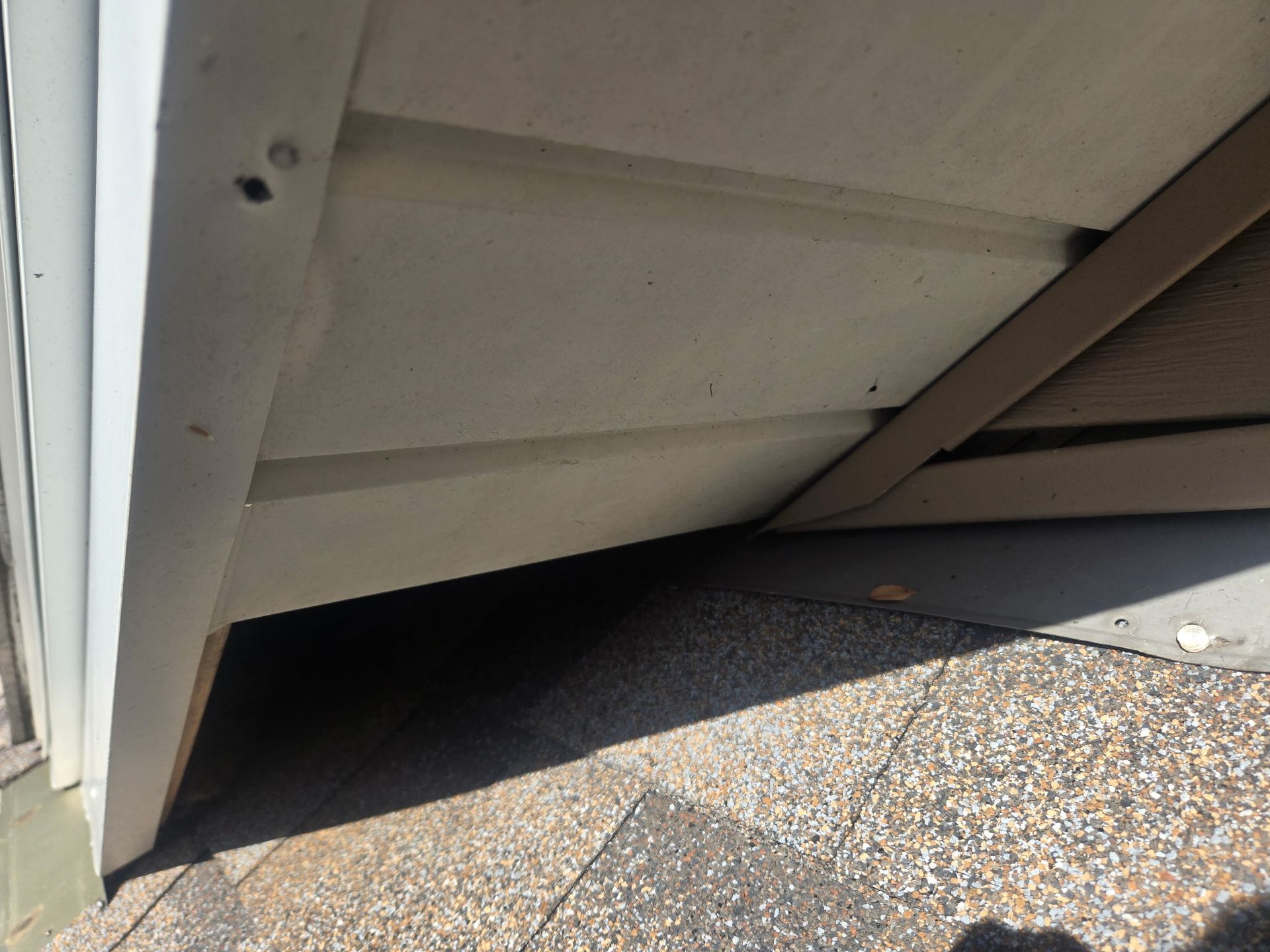 Open gap beneath a soffit return at the roofline of a home in Roscoe, IL, creating an entry point for squirrels and other wildlife.