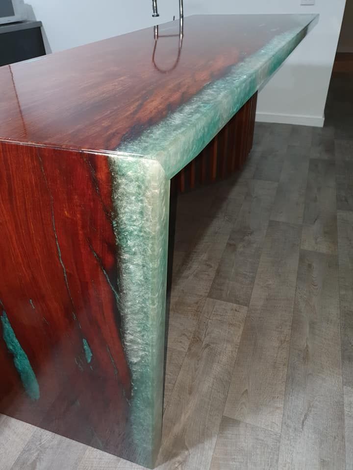 A Kitchen Island Made of Polished Reddish-brown Wood — Crowfoot Constructions in Dubbo, NSW