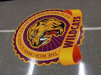 A logo for the worthman school ps 275 wildcats