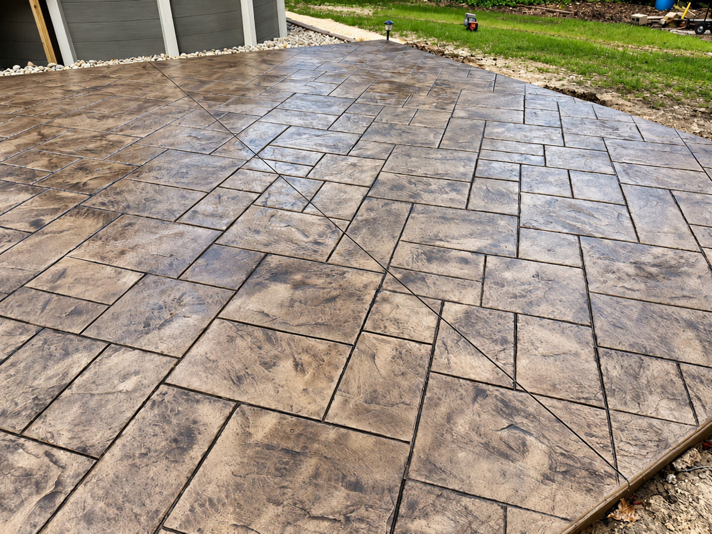 Stamped concrete patio shows natural stone pattern after Concrete Services in Eagan, MN for decorative outdoor flooring.