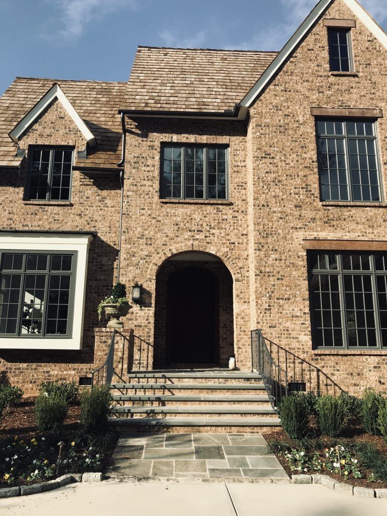 A large brick house with a lot of windows