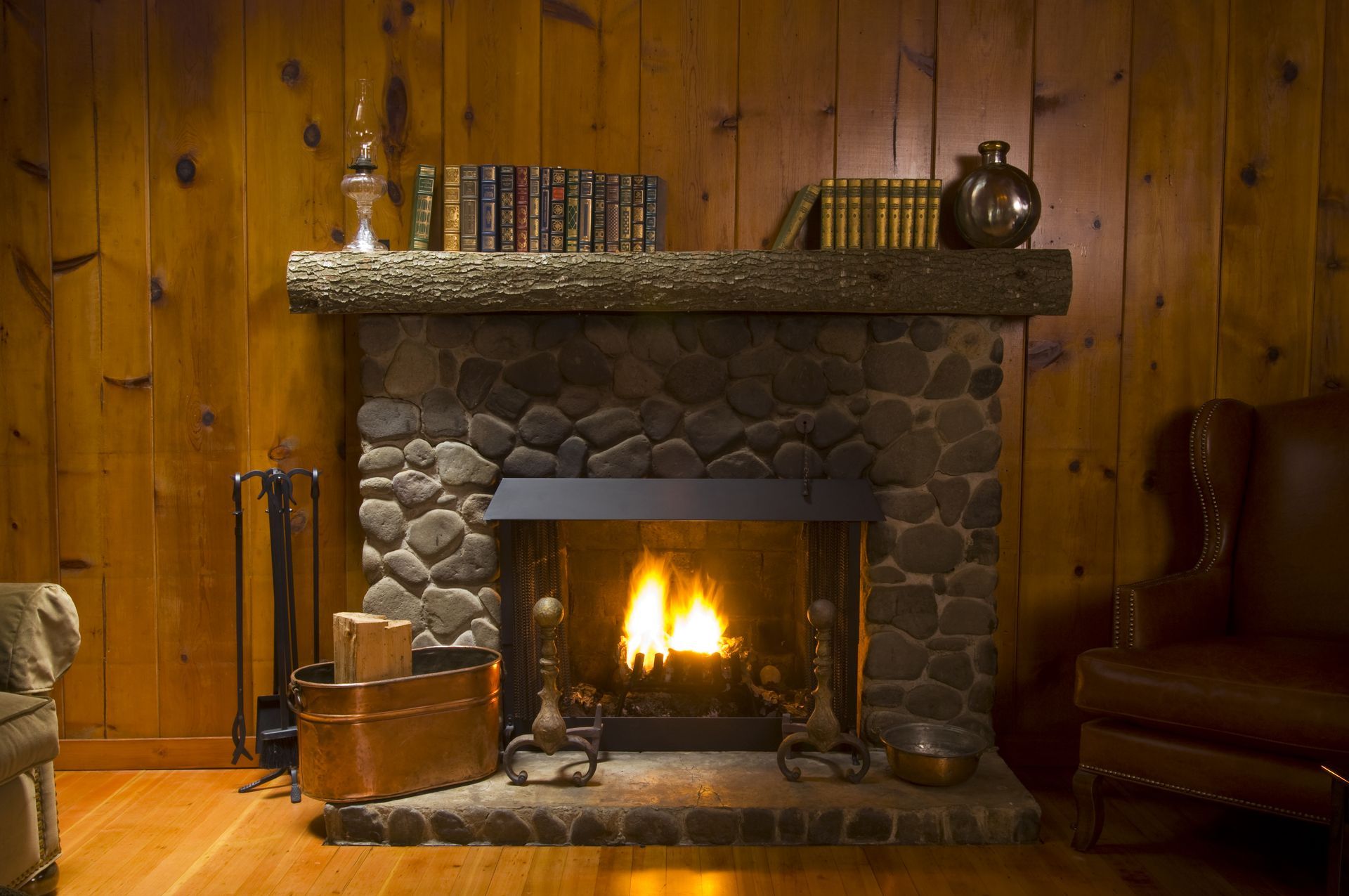 a living room with a fireplace and a chair