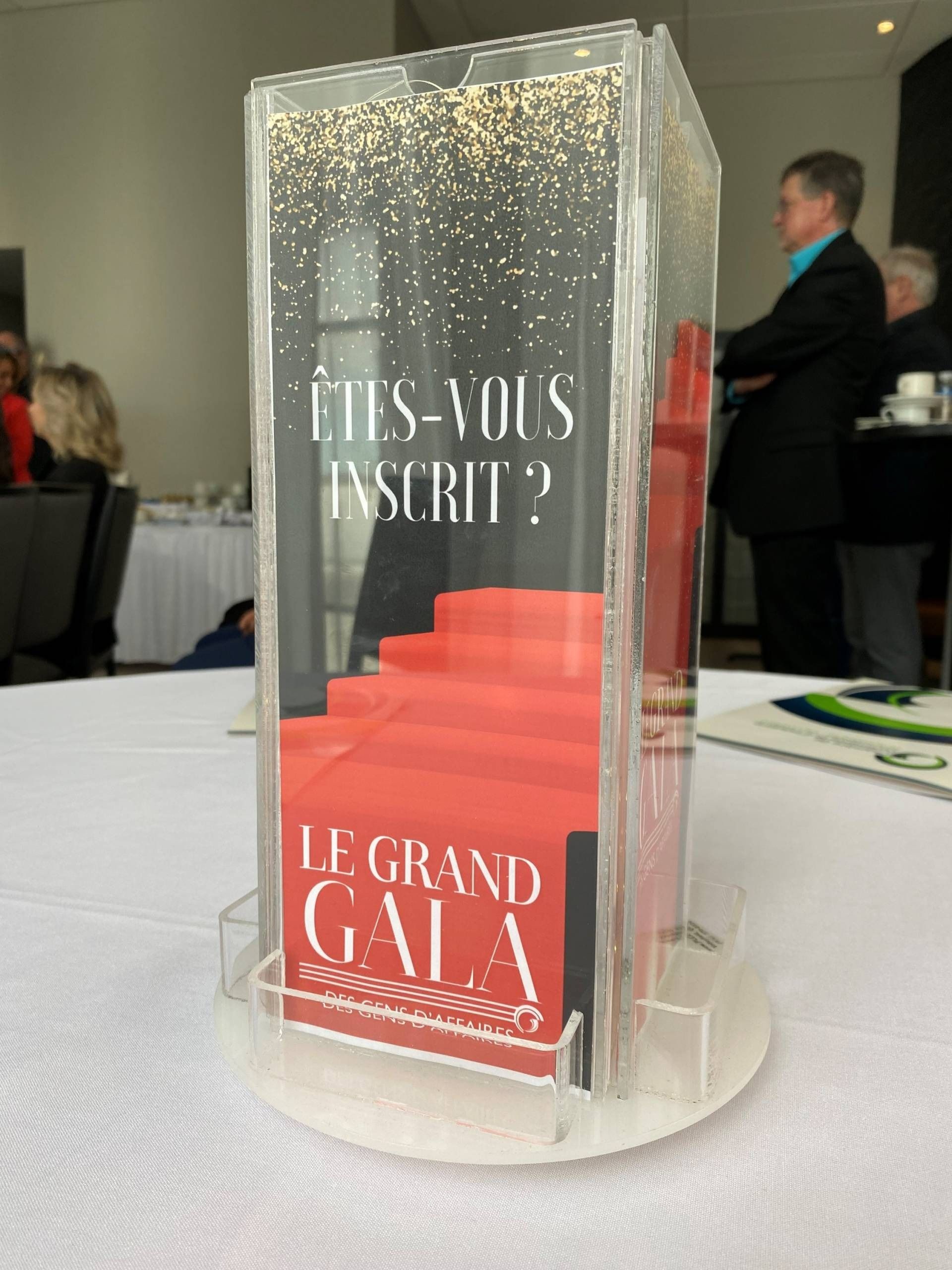 Clear acrylic display holding a brochure for 