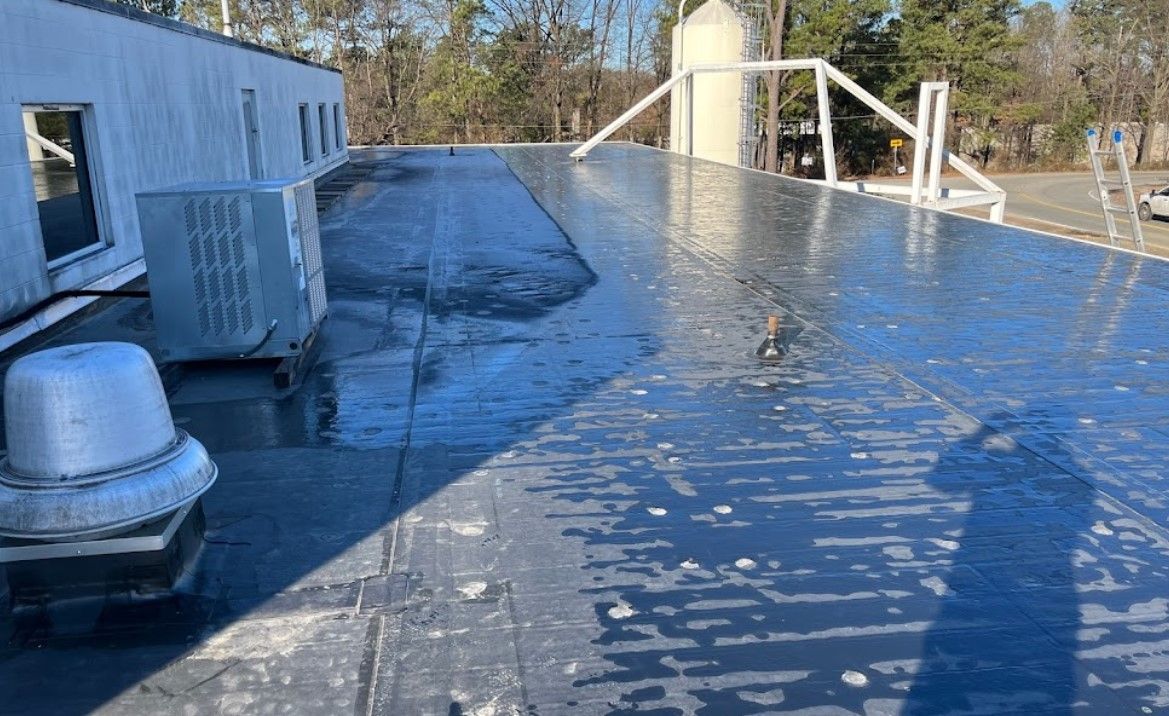 A roof of a building with a lot of water on it.