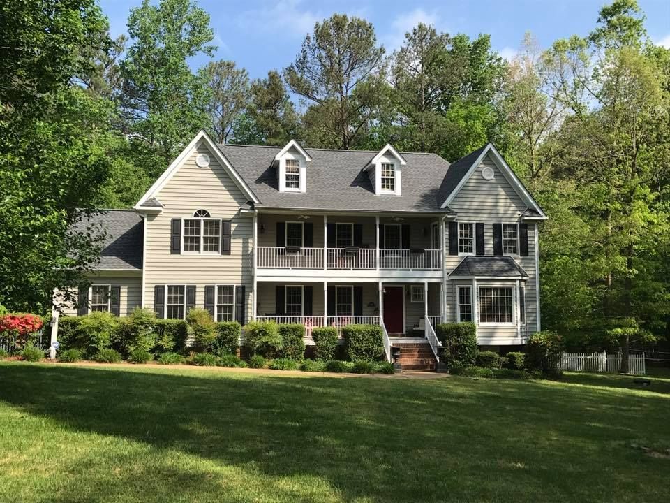 A large house with a large lawn in front of it