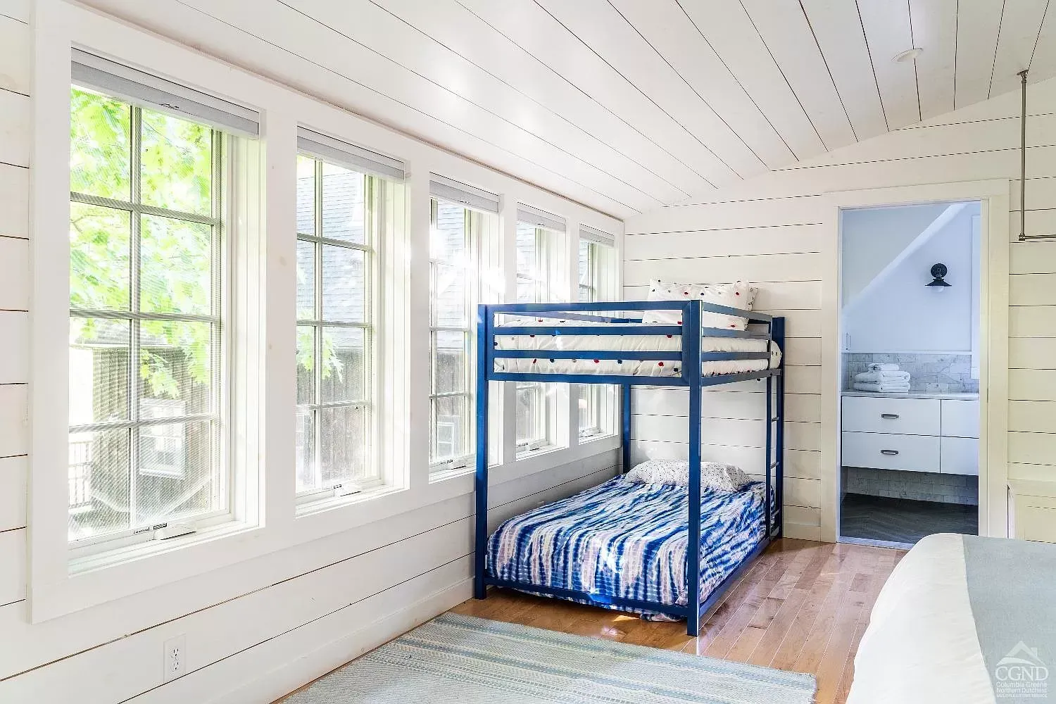 There is a bunk bed in the middle of the room.