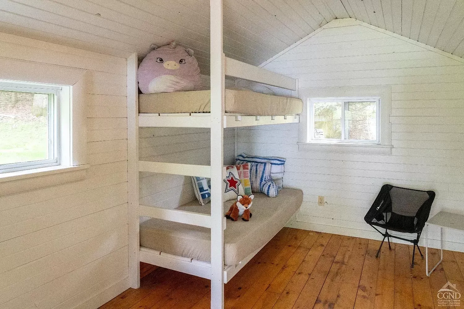 There is a bunk bed in the middle of the room.