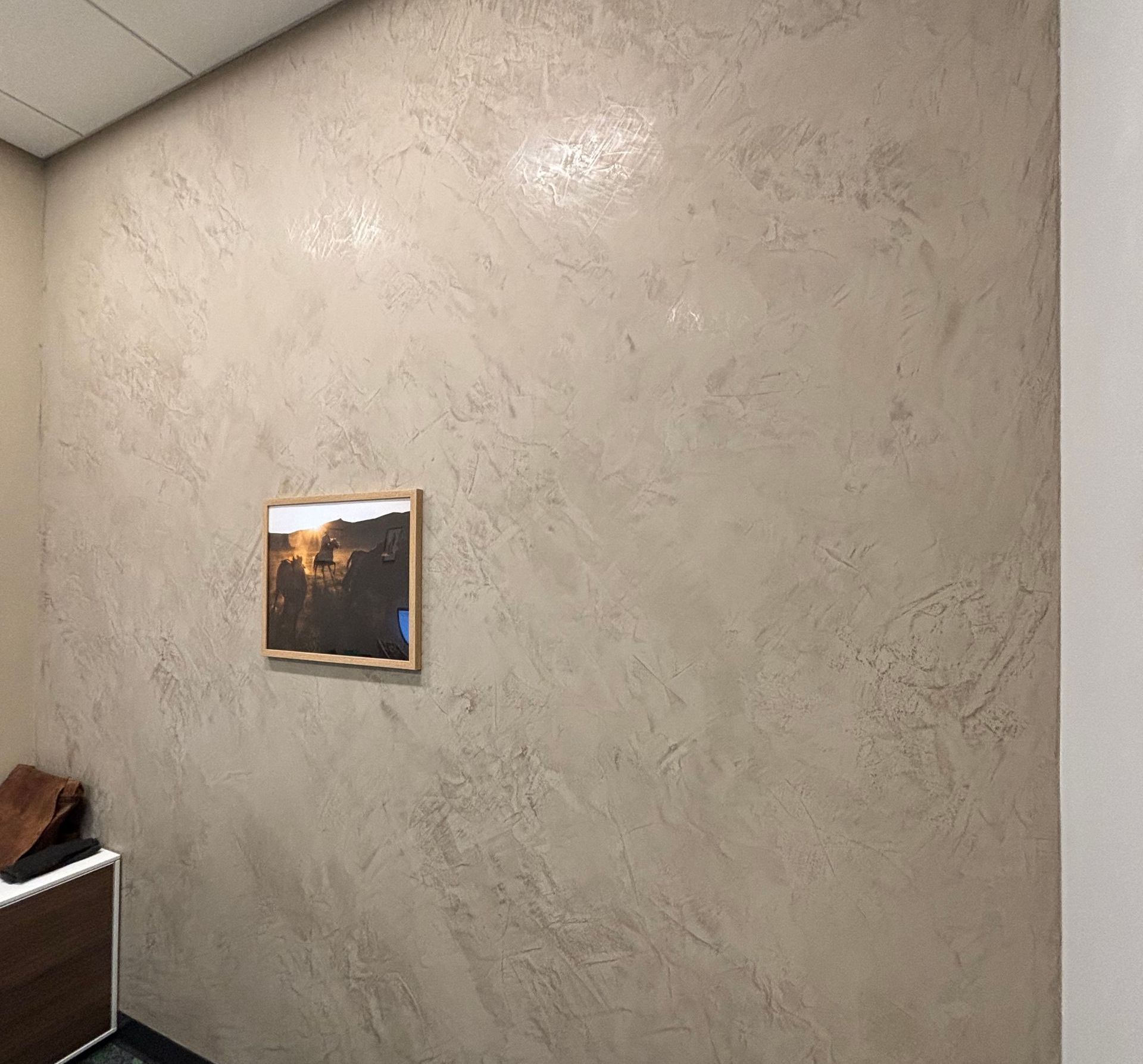 There is a picture on the wall in the room.