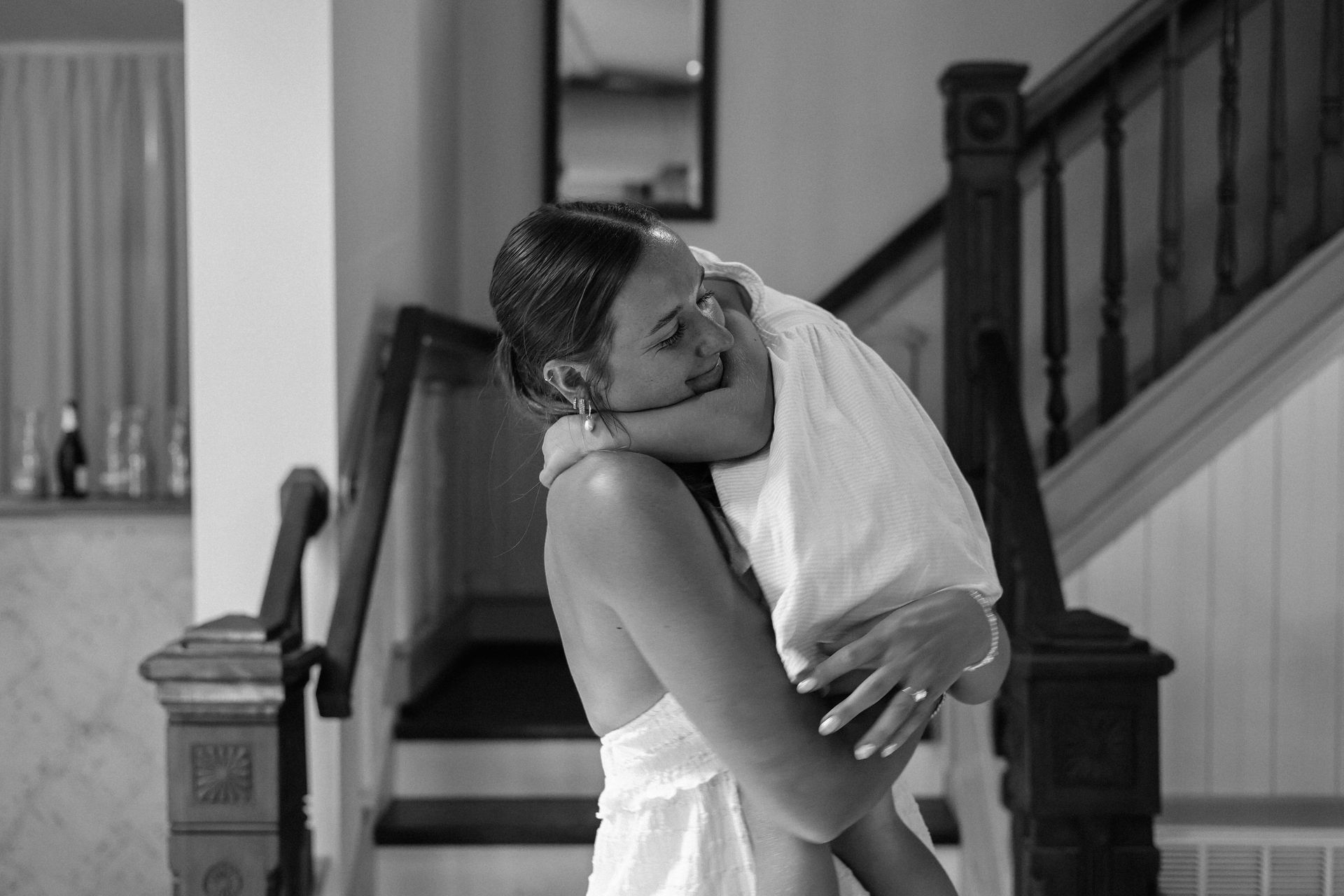 Black and white photo of an emotional embrace before the ceremony