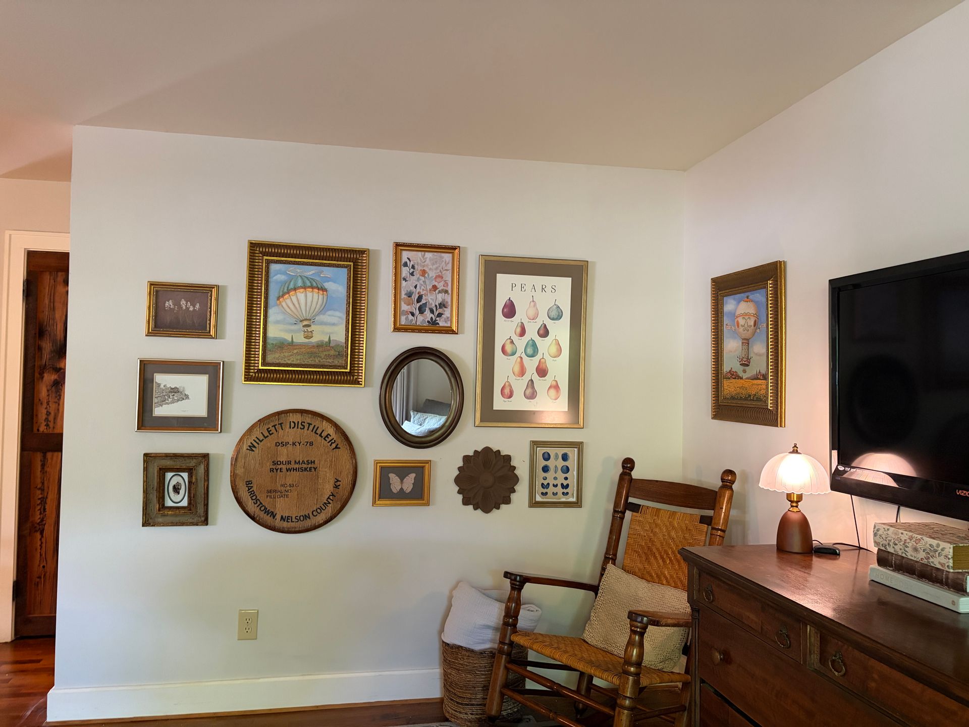 Loft living room gallery wall with framed art and a mirror