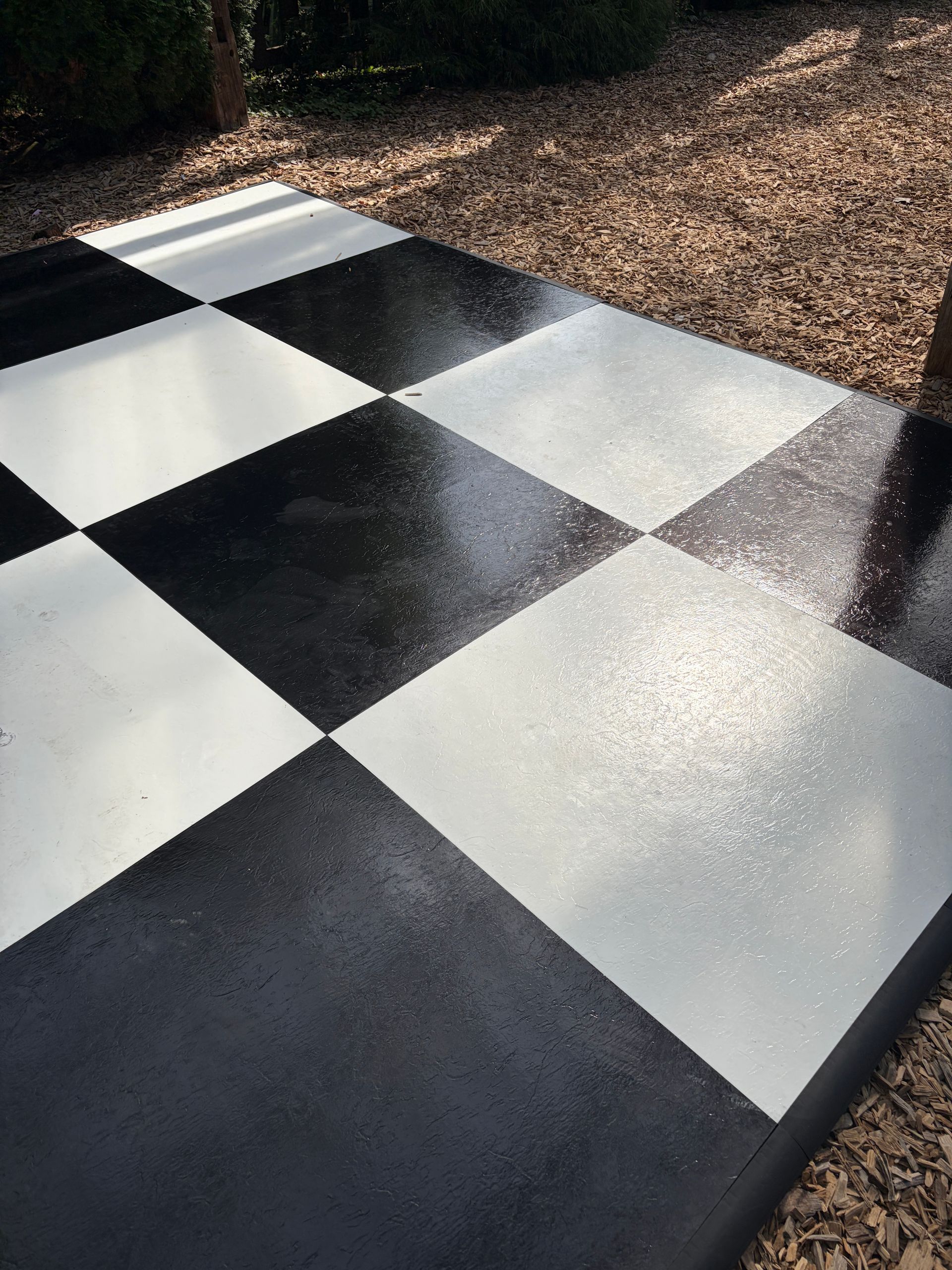 Close-up of the glossy black and white diamond dance floor