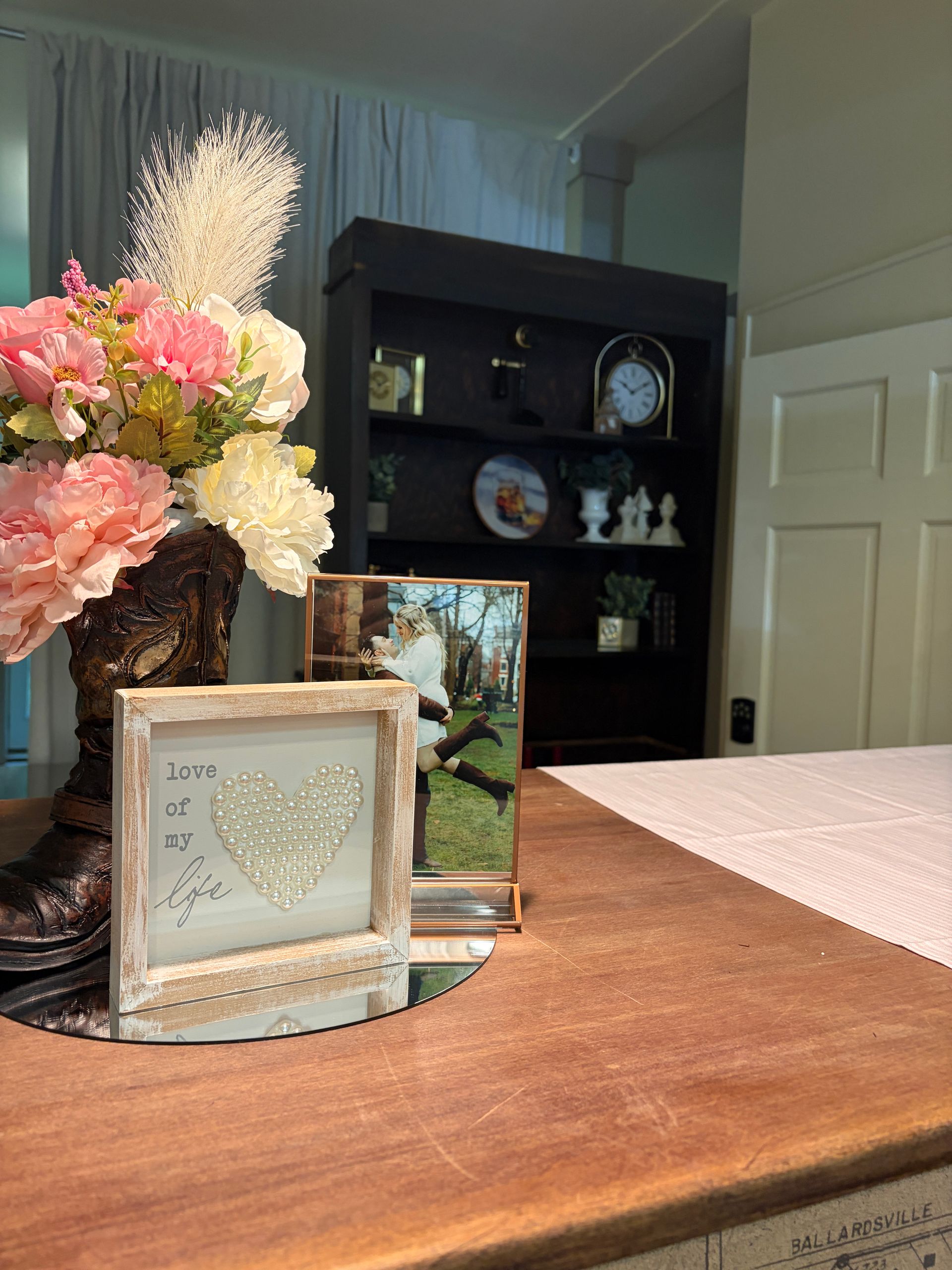Welcome table vignette with an engagement photo