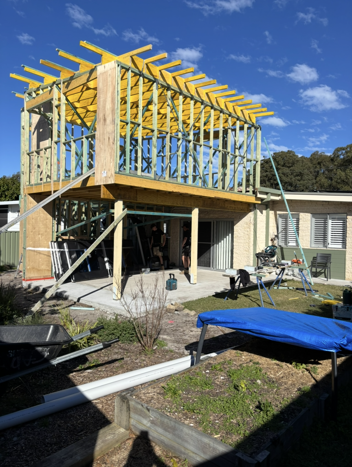A Modern House With Large Glass Windows and a Gray Roof. a Set of Steps Leads to the Entrance, and a Lawn is in Front — Campbell Built in Nelson Bay, NSW