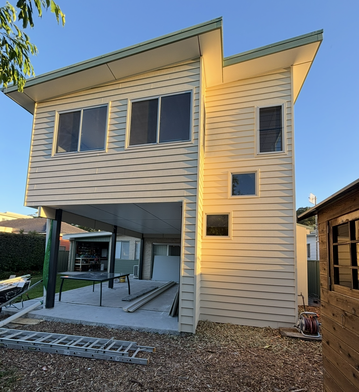 Wooden french doors set in a brick building, black handle — Campbell Built in Nelson Bay, NSW