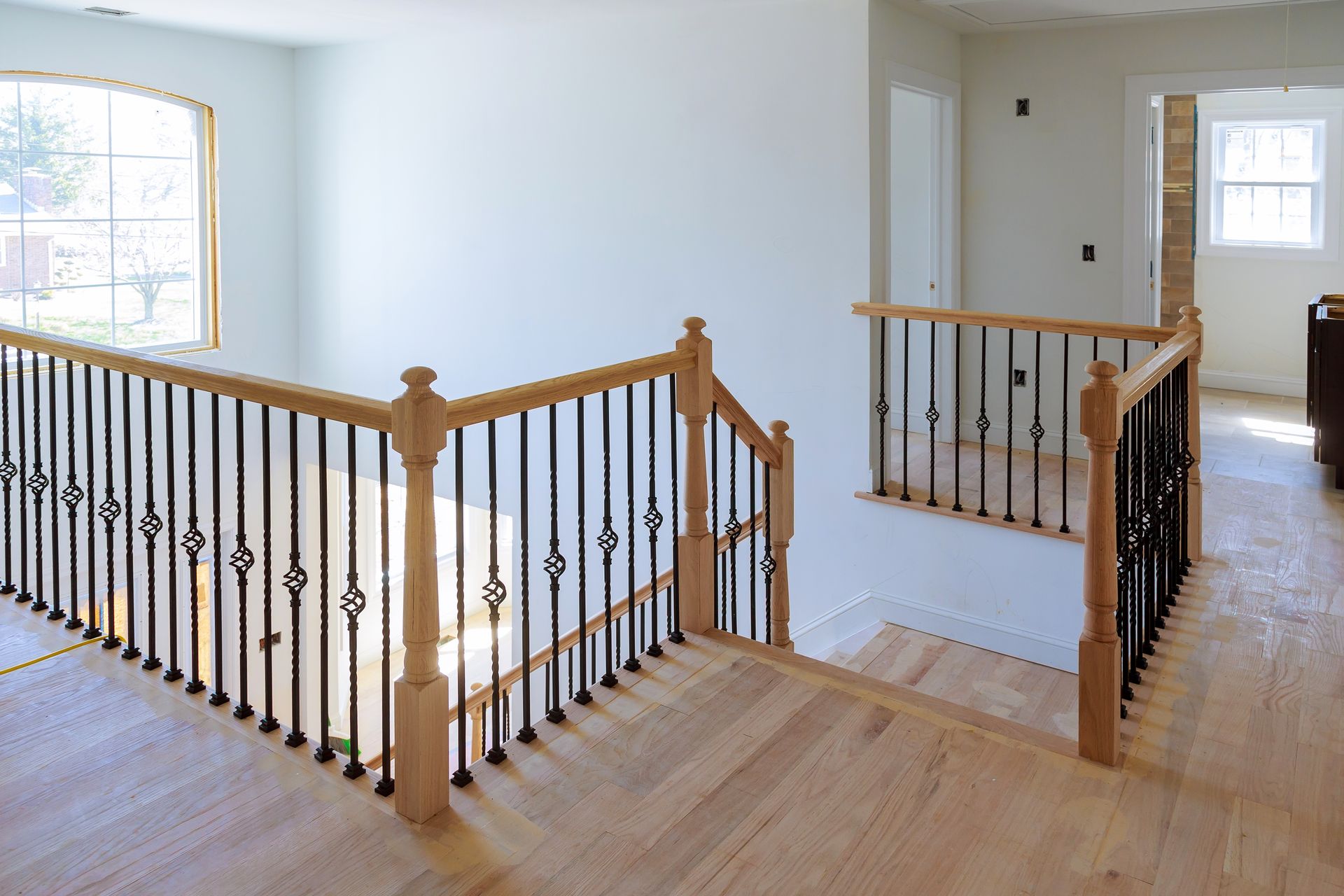 Interior view of a staircase with wood flooring.