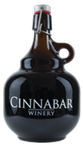 A dark glass, jug-style wine bottle with a swing-top lid and a handle, labeled 