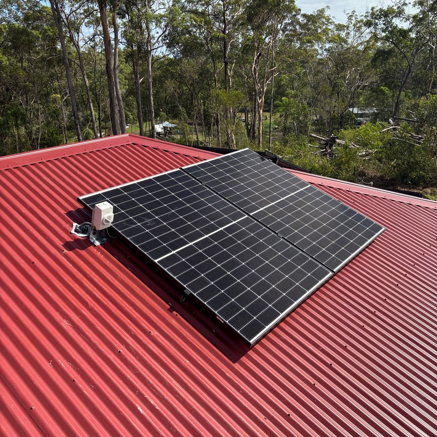Solar Panels Mounted on A Red Metal Roof — Macleay Energy Solutions In Kempsey, NSW