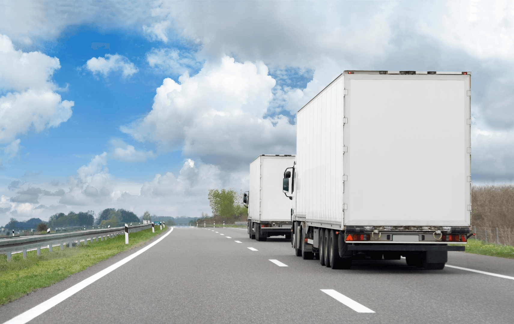 Interstate Moves - Two MUVR trucks going down a highway during a long distance move to Charlotte North Carolina