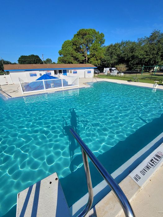 A before and after picture of a swimming pool being built.
