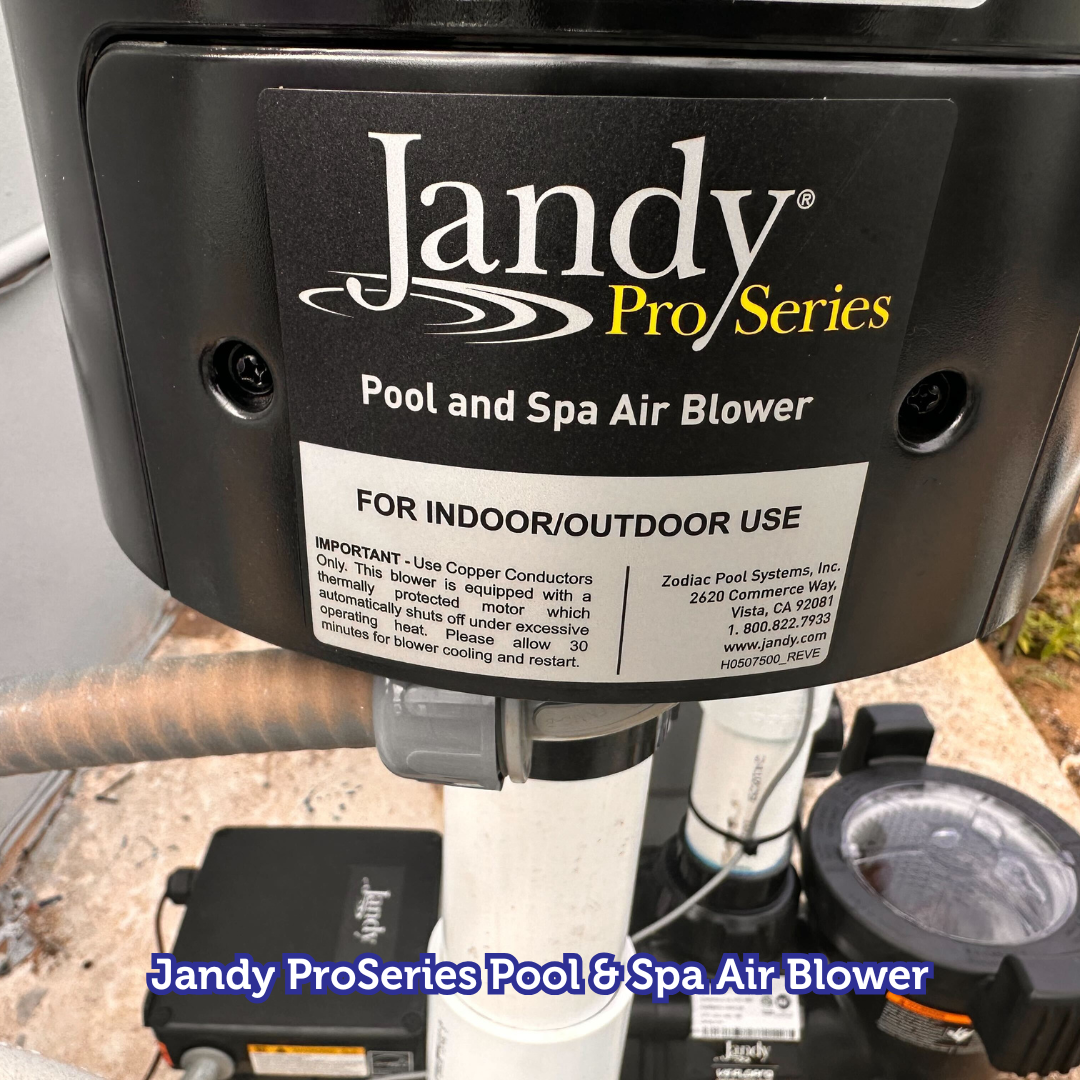Jandy ProSeries pool and spa air blower.  Mounted on white pipe and other pool equipment.