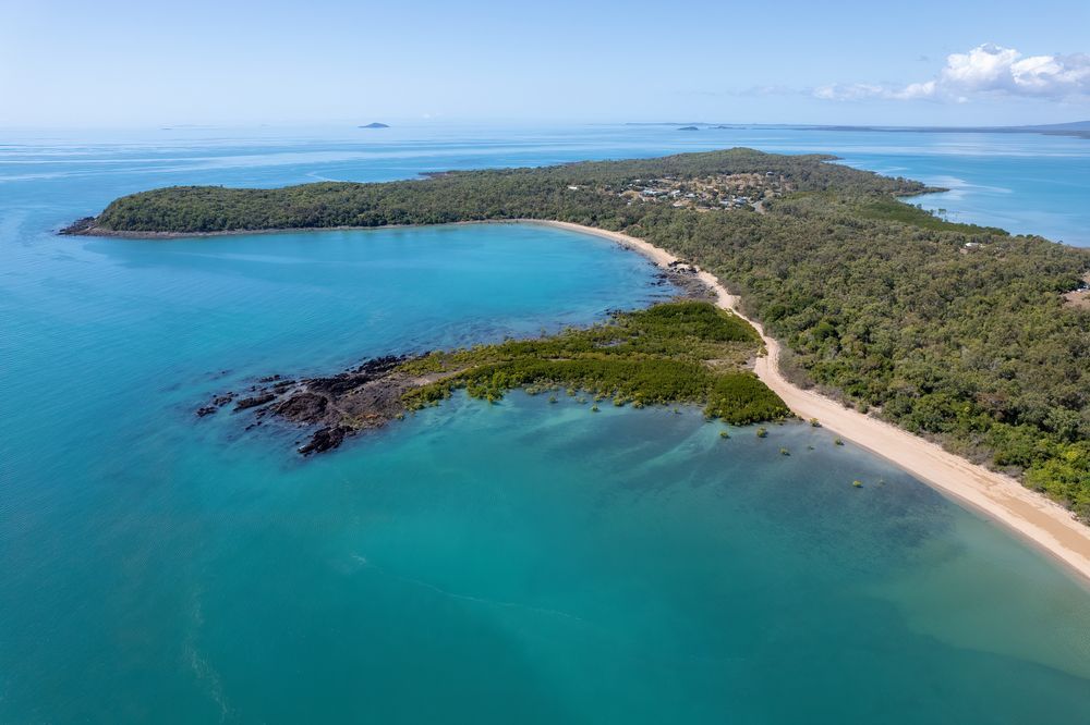 An Aerial View Of A Small Island In The Middle Of The Ocean — Aaron Lee Painting Pty Ltd In Bushland Beach, QLD