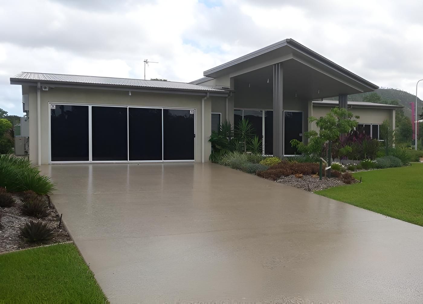 A Large House With A Large Driveway In Front Of It — Aaron Lee Painting Pty Ltd In Balgal Beach, QLD